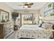 Main bedroom with king-size bed, ceiling fan, and sliding glass doors at 1001 World Tour Blvd. # 101A, Myrtle Beach, SC 29579