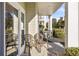 Covered patio with seating area and view of landscaping at 1001 World Tour Blvd. # 101A, Myrtle Beach, SC 29579