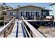 Beach house back deck with ocean views and walkway at 102 Seaview Loop, Pawleys Island, SC 29585