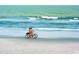 Couple enjoying a relaxing bike ride on the beach at 102 Seaview Loop, Pawleys Island, SC 29585