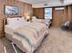 Spacious bedroom with two beds and wood-paneled walls at 102 Seaview Loop, Pawleys Island, SC 29585