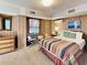 Bedroom with queen bed, dresser, and sitting area at 102 Seaview Loop, Pawleys Island, SC 29585