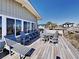 Relaxing deck with table, chairs, and lounge chairs at 102 Seaview Loop, Pawleys Island, SC 29585