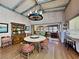 Bright dining room with round table, wooden chairs, and a view into the living area at 102 Seaview Loop, Pawleys Island, SC 29585