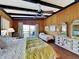 Main bedroom with king bed, twin bed, and access to a private deck with ocean views at 102 Seaview Loop, Pawleys Island, SC 29585