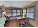 Small office space with wooden desk and two chairs near window at 102 Seaview Loop, Pawleys Island, SC 29585