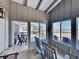 Sunroom with rocking chairs, ocean view, and access to deck at 102 Seaview Loop, Pawleys Island, SC 29585