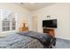 Well lit bedroom with a full bed, and a ceiling fan at 1058 Sea Mountain Hwy. # 1-303, North Myrtle Beach, SC 29582