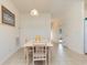 Bright dining room with four chairs and view into hallway at 1058 Sea Mountain Hwy. # 1-303, North Myrtle Beach, SC 29582