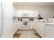 White kitchen with ample cabinetry, microwave, and stovetop at 1058 Sea Mountain Hwy. # 1-303, North Myrtle Beach, SC 29582