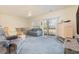 Living room features carpet, two sofas, and sliding glass doors to balcony at 1058 Sea Mountain Hwy. # 1-303, North Myrtle Beach, SC 29582
