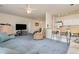 Open concept living room and kitchen with breakfast bar and seating at 1058 Sea Mountain Hwy. # 1-303, North Myrtle Beach, SC 29582