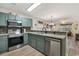 Modern kitchen with stainless steel appliances and light green cabinets at 1266 River Oak Dr. # 12A, Myrtle Beach, SC 29579