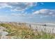 Scenic beach view with sea oats and people enjoying the beach at 1356 Glenns Bay Rd. # 208M, Surfside Beach, SC 29575