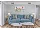 Living room with teal couch and coffee tables at 1356 Glenns Bay Rd. # 208M, Surfside Beach, SC 29575