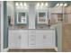 Bright bathroom featuring double sinks, granite countertops, white cabinets, and a glass shower at 1405 Osprey Pointe Ln., North Myrtle Beach, SC 29582