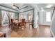 Spacious dining room features tray ceiling, wood-look tile flooring and ample natural light at 1405 Osprey Pointe Ln., North Myrtle Beach, SC 29582