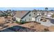 Landscaped backyard featuring a stone patio, a built-in firepit, and a well-maintained lawn surrounding a single-Gathering home at 1405 Osprey Pointe Ln., North Myrtle Beach, SC 29582