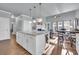 Spacious kitchen with island opens to living room, complete with modern finishes and natural light at 1405 Osprey Pointe Ln., North Myrtle Beach, SC 29582