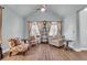 This bright living room is complete with a ceiling fan, tile floors, and three comfortable chairs at 1405 Osprey Pointe Ln., North Myrtle Beach, SC 29582