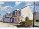 Gray multi-unit building with maroon window trim and landscaping at 1880 Colony Dr. # 12-H, Surfside Beach, SC 29575