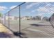 Community tennis court with chain link fence at 1880 Colony Dr. # 12-H, Surfside Beach, SC 29575