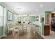 Dining area with hardwood floors and adjacent kitchen at 1897 Culbertson Ave. # 1897, Myrtle Beach, SC 29577