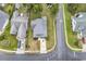 Aerial view of the property showcasing the roof, yard, driveway, and surrounding neighborhood at 1900 Shell Ct., Surfside Beach, SC 29575