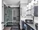 Modern bathroom featuring a walk-in shower with glass door and double vanity sinks at 1900 Shell Ct., Surfside Beach, SC 29575
