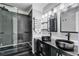 Bathroom featuring double vanity sinks and walk-in shower with glass door at 1900 Shell Ct., Surfside Beach, SC 29575