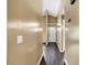 Hallway with warm colored walls and dark hardwood floors, leading to the entrance at 1900 Shell Ct., Surfside Beach, SC 29575