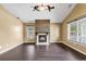 Bright living room with fireplace, hardwood floors, and windows at 1900 Shell Ct., Surfside Beach, SC 29575