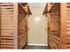 Walk-in closet featuring custom wood shelving and storage space at 1900 Shell Ct., Surfside Beach, SC 29575
