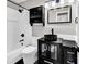 Stylish bathroom featuring a modern black vanity, a sleek vessel sink, and contemporary fixtures at 1900 Shell Ct., Surfside Beach, SC 29575