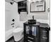 Bathroom features a modern black vanity, sleek vessel sink, a framed mirror, and brushed-nickel fixtures at 1900 Shell Ct., Surfside Beach, SC 29575