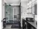 Modern bathroom showcasing a sleek glass shower and stylish black vanity at 1900 Shell Ct., Surfside Beach, SC 29575