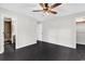 Bedroom featuring dark hardwood floors, ceiling fan, with a walk-in closet at 1900 Shell Ct., Surfside Beach, SC 29575