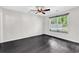 Well-lit bedroom featuring hardwood floors and a window to let in natural light at 1900 Shell Ct., Surfside Beach, SC 29575