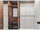 Wooden closet with bar and shelves, perfect for clothes storage at 1900 Shell Ct., Surfside Beach, SC 29575