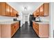 Long kitchen area with light brown cabinets and black appliances at 1900 Shell Ct., Surfside Beach, SC 29575