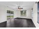 Bright living area features wood floors and sliding glass doors to patio at 1900 Shell Ct., Surfside Beach, SC 29575