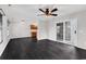 Spacious living area with wood floors and a ceiling fan at 1900 Shell Ct., Surfside Beach, SC 29575