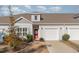 House exterior with gray siding, orange door, and two-car garage at 192 Sea Shell Dr. # 22, Murrells Inlet, SC 29576