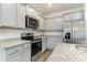 Modern kitchen featuring stainless steel appliances and granite countertops at 192 Sea Shell Dr. # 22, Murrells Inlet, SC 29576