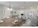 Living room with round dining table and comfy seating at 192 Sea Shell Dr. # 22, Murrells Inlet, SC 29576