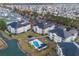 Aerial view of community featuring pond, pool, and well-manicured landscaping at 2060 Cross Gate Blvd. # 204, Surfside Beach, SC 29575