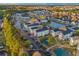 Scenic aerial perspective of a charming residential area with condos, ponds, and lush landscaping at 2060 Cross Gate Blvd. # 204, Surfside Beach, SC 29575