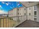 Spacious balcony with views of a building and grassy landscape at 2060 Cross Gate Blvd. # 204, Surfside Beach, SC 29575