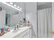 Bright bathroom featuring a large mirror, ample counter space, and neutral walls at 2060 Cross Gate Blvd. # 204, Surfside Beach, SC 29575