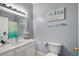 Clean bathroom with a single sink vanity, toilet, and neutral walls at 2060 Cross Gate Blvd. # 204, Surfside Beach, SC 29575